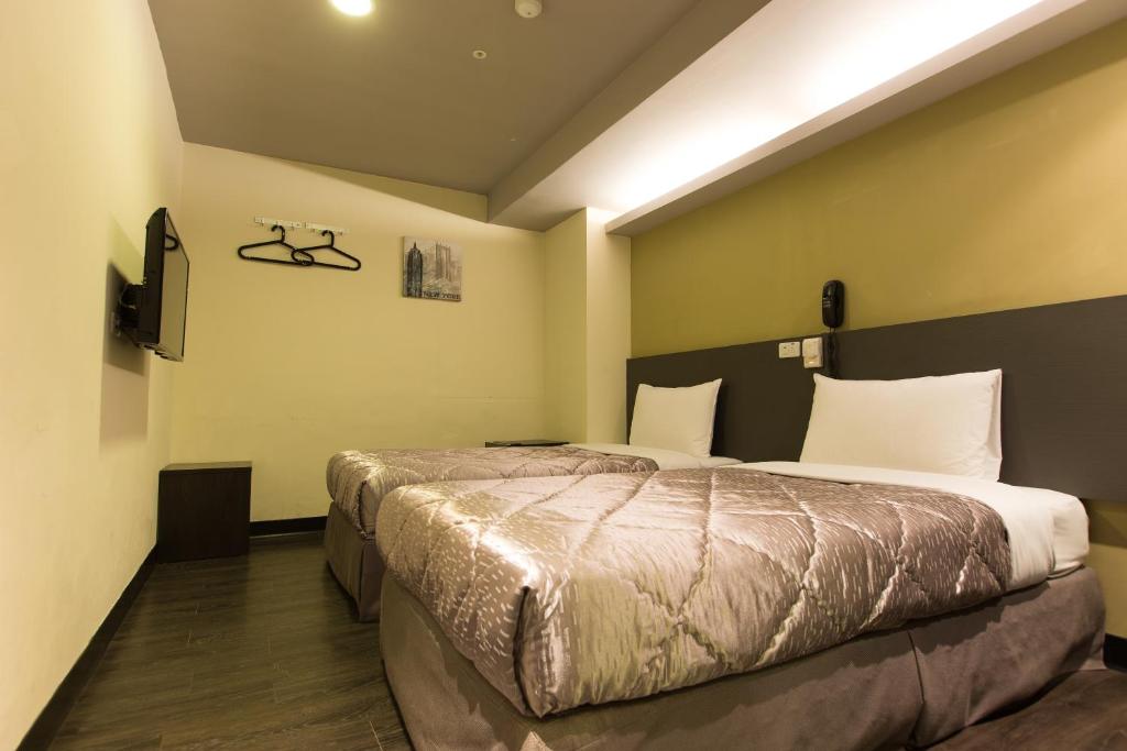 Postel nebo postele na pokoji v ubytování Chance Hotel