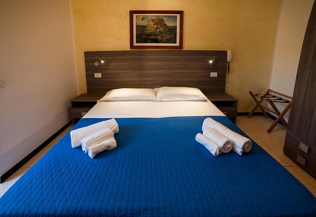 Postel nebo postele na pokoji v ubytování Hotel Madison