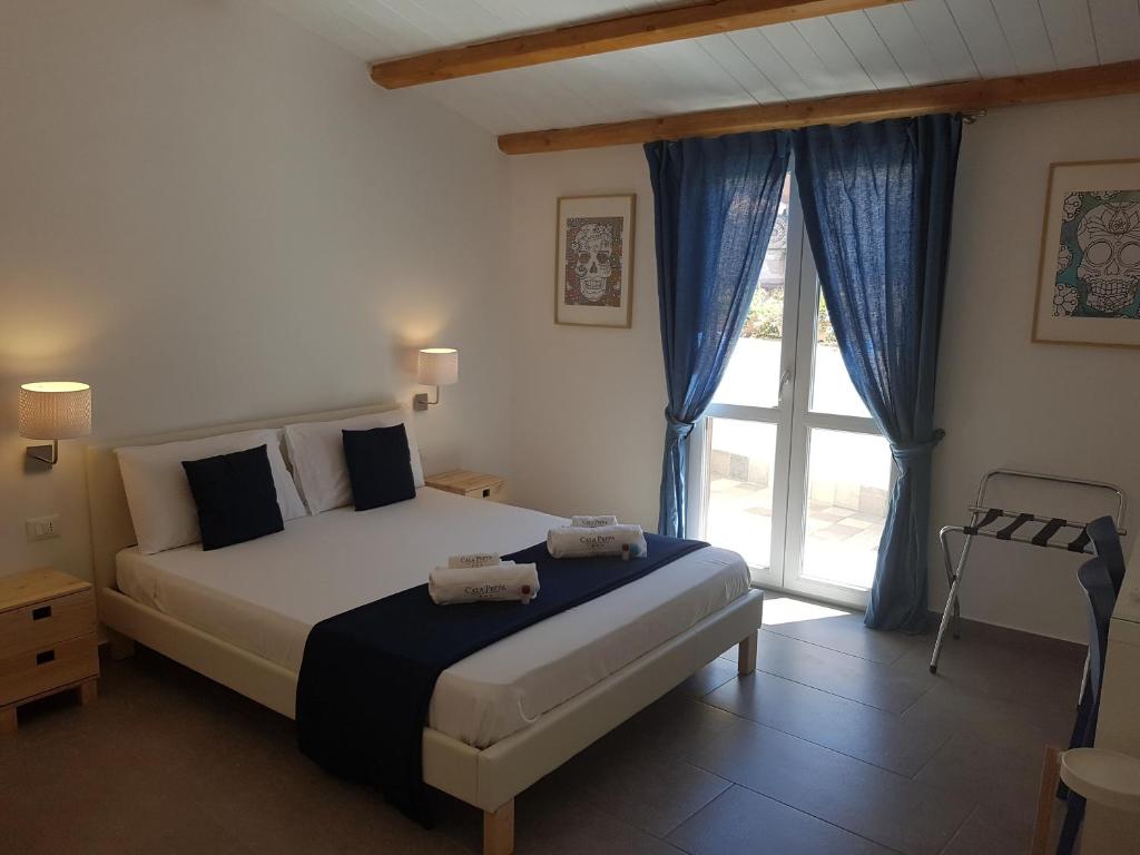 Posteľ alebo postele v izbe v ubytovaní B&B Cala Peppa