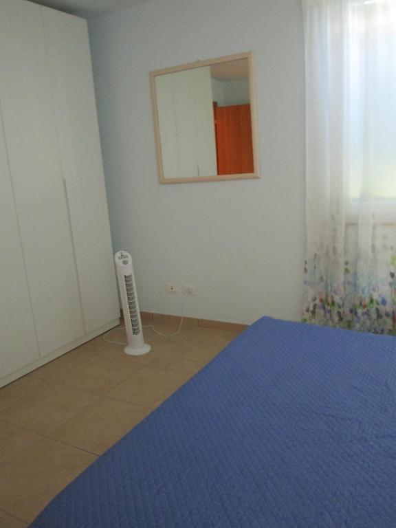 Łóżko lub łóżka w pokoju w obiekcie Appartamenti Di Laura