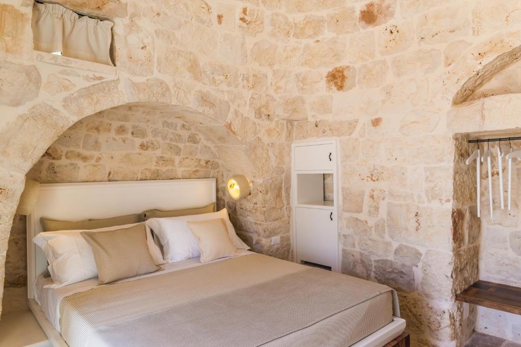 Postel nebo postele na pokoji v ubytování Borgo Canonica