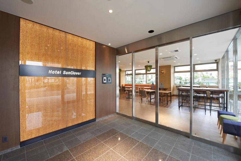 a view of a mall entrance with a dining room at Hotel Sun Clover Koshigaya Eki mae in Koshigaya