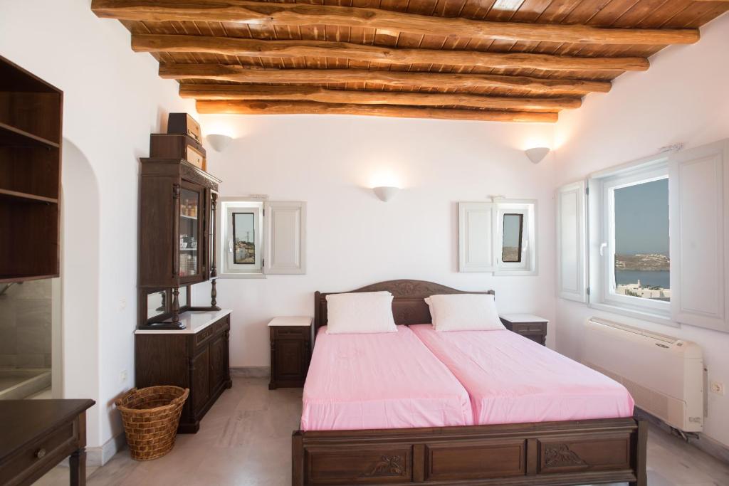 מיטה או מיטות בחדר ב-Bleland Mykonos