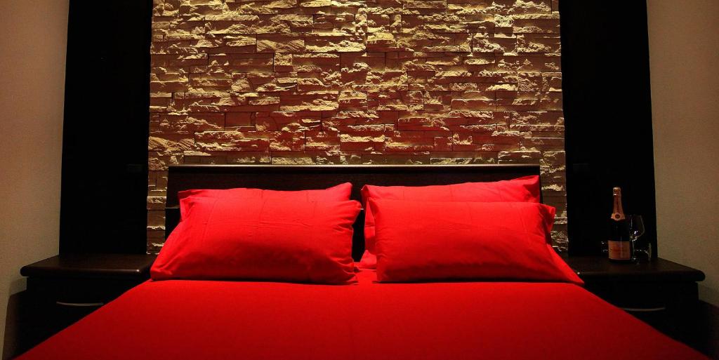 Postel nebo postele na pokoji v ubytování B&B La Bouganville