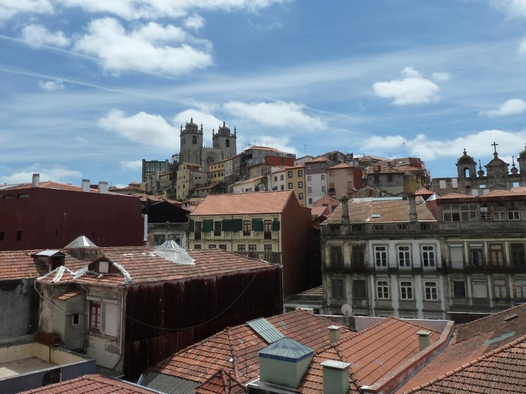 a view of a city with buildings and roofs at Flowerstreet 54 in Porto