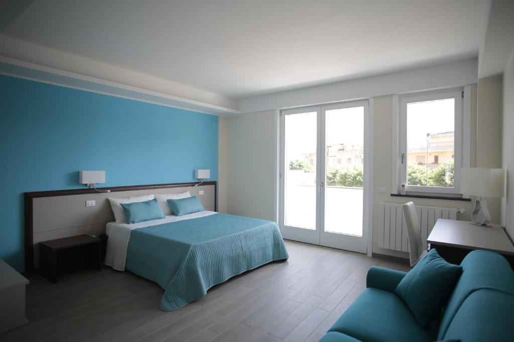 Postel nebo postele na pokoji v ubytování Sud Est Guest House