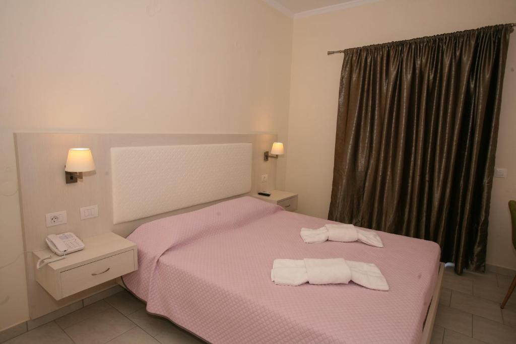 A bed or beds in a room at Saint George Palace