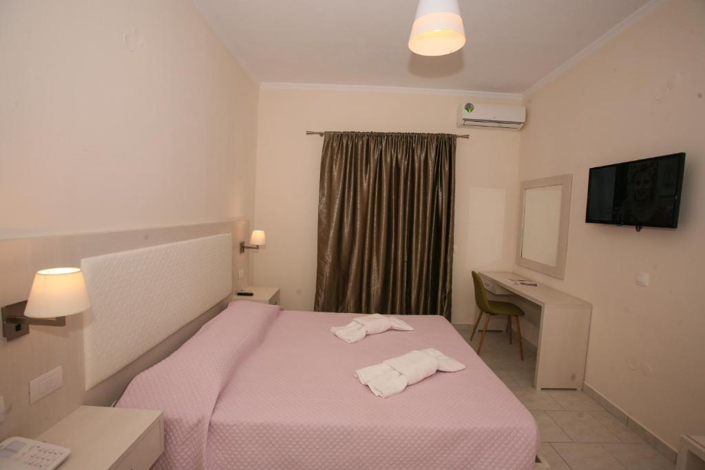 A bed or beds in a room at Saint George Palace