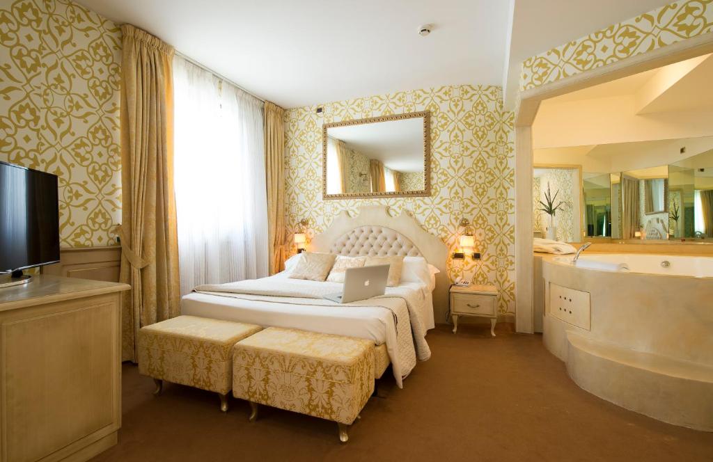 Postel nebo postele na pokoji v ubytování Hotel il Castelletto