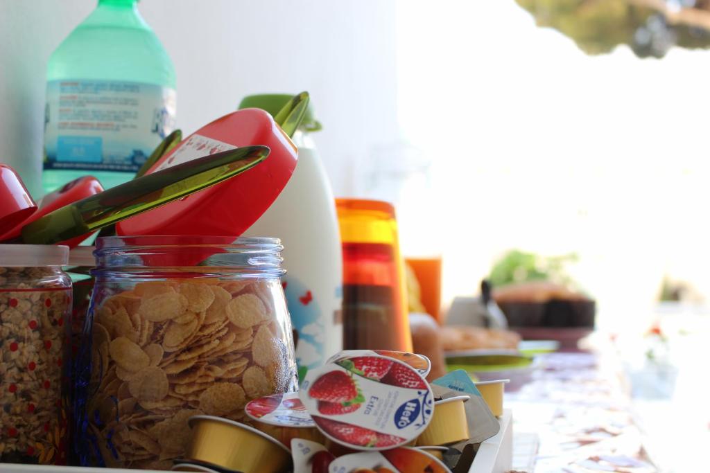 a counter topped with jars of food and nuts at Villa Pollio Guest House in Anacapri