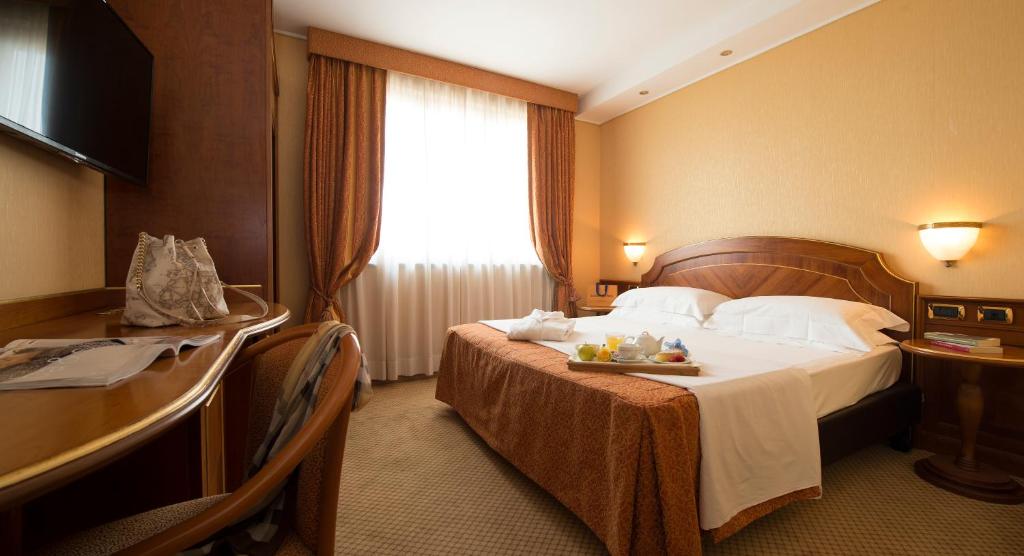 Postel nebo postele na pokoji v ubytování Hotel il Castelletto