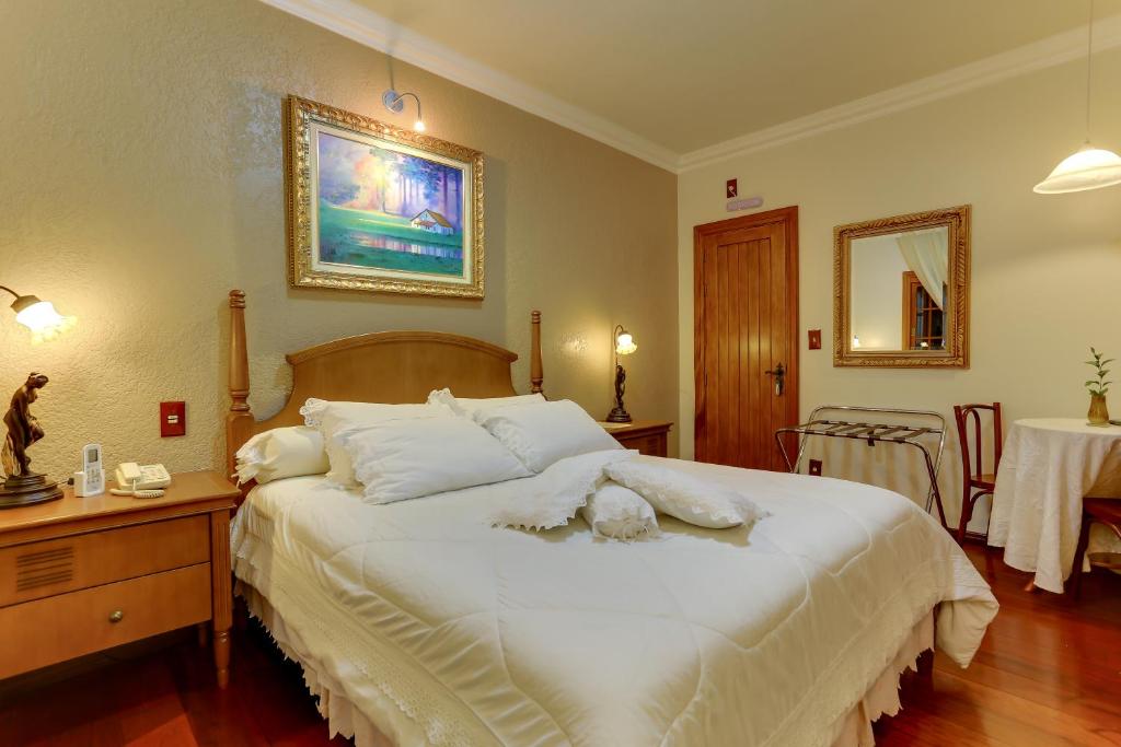 Postel nebo postele na pokoji v ubytování Hotel Pousada Florença