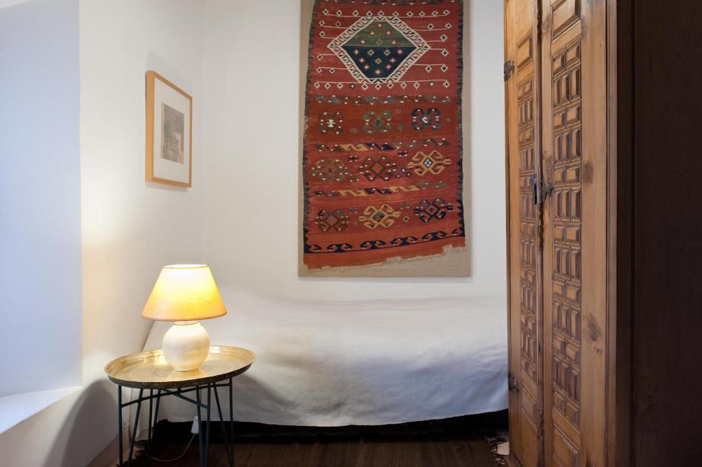 Postel nebo postele na pokoji v ubytování Riyad El Cadi