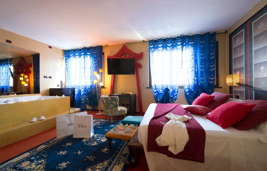 Postel nebo postele na pokoji v ubytování Hotel il Castelletto