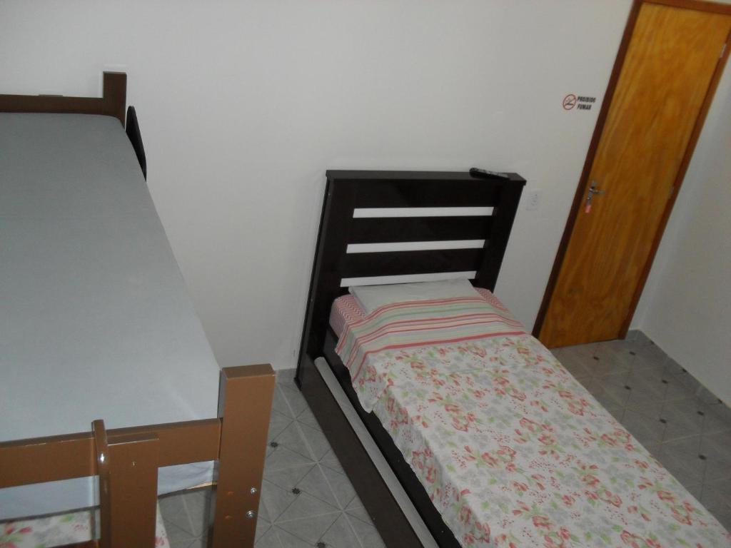 Postel nebo postele na pokoji v ubytování Hotel Niteroi
