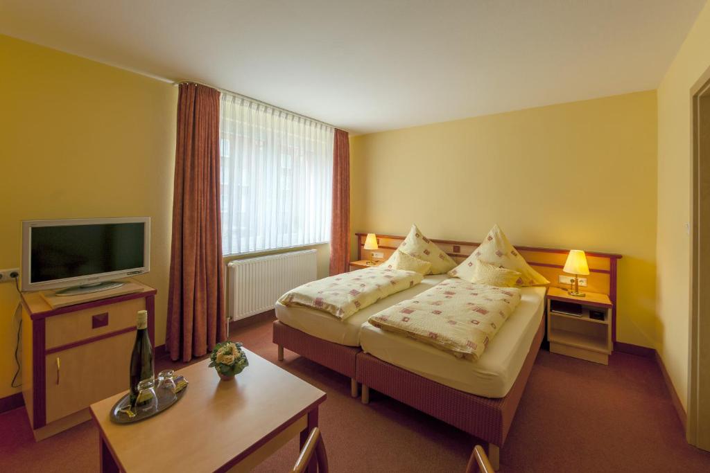 Postel nebo postele na pokoji v ubytování Hotel Atlantis