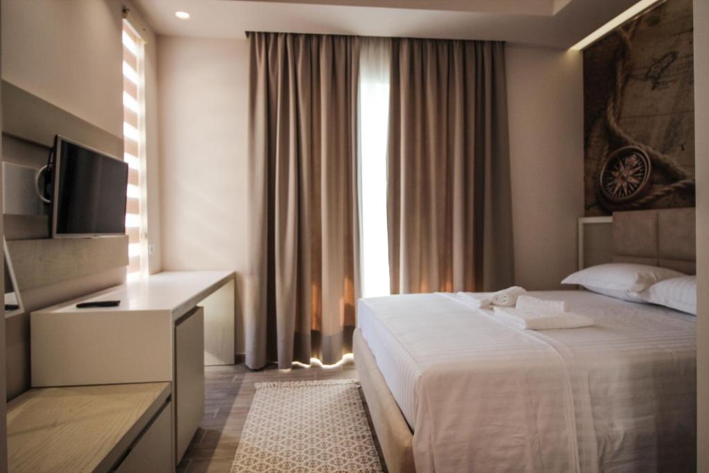 Postel nebo postele na pokoji v ubytování Hotel Kristera