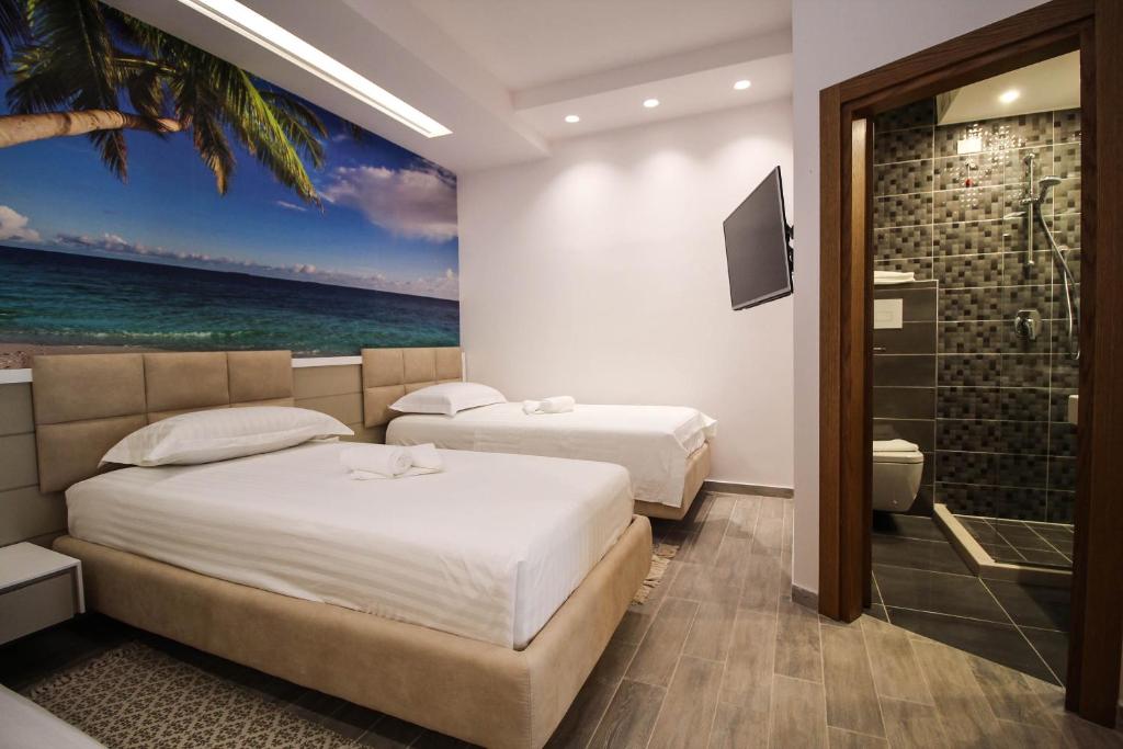 Postel nebo postele na pokoji v ubytování Hotel Kristera
