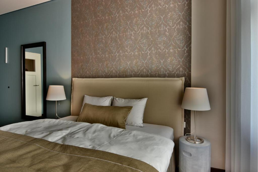 Postel nebo postele na pokoji v ubytování Carl.22 City Appartements