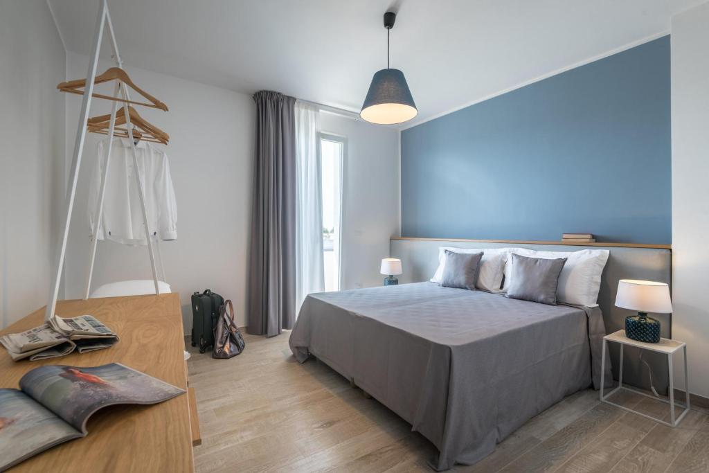 Postel nebo postele na pokoji v ubytování Calura Residence