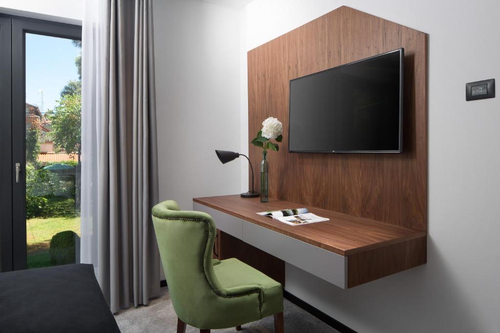 TV a/nebo společenská místnost v ubytování Hotel Delfin