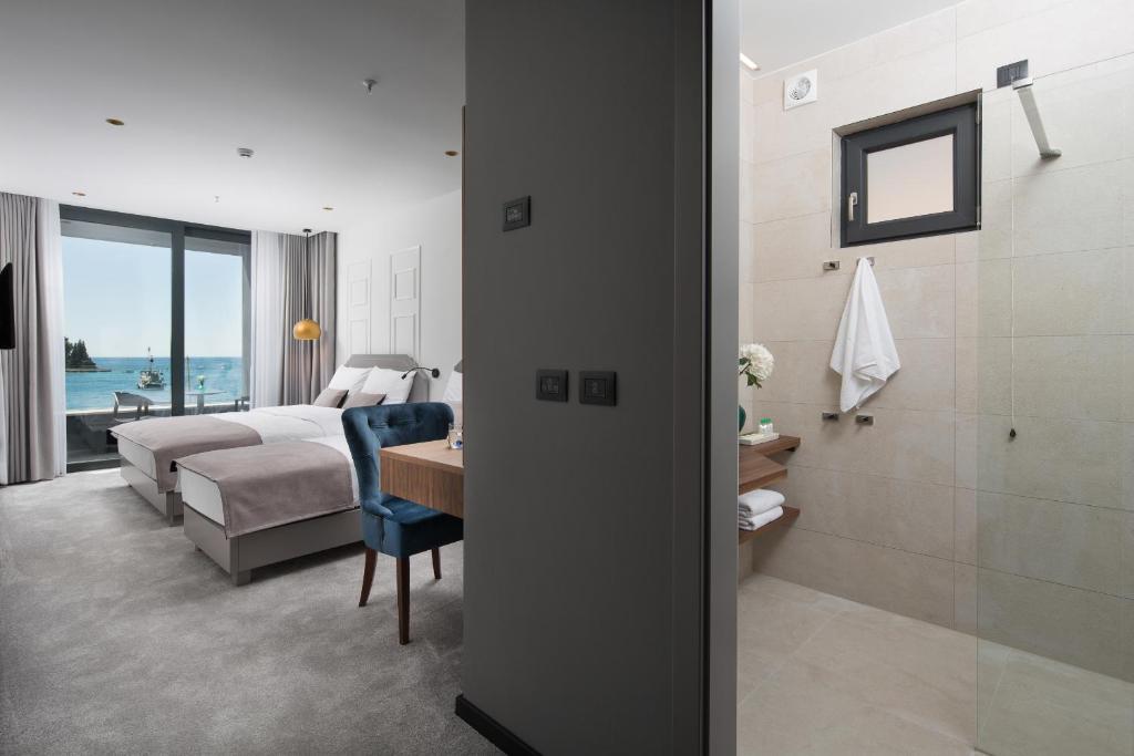 Postel nebo postele na pokoji v ubytování Hotel Delfin