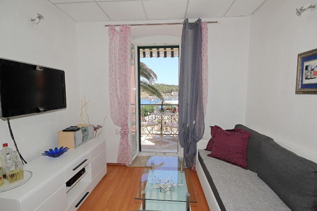 Televízia a/alebo spoločenská miestnosť v ubytovaní Apartment Adriatica City