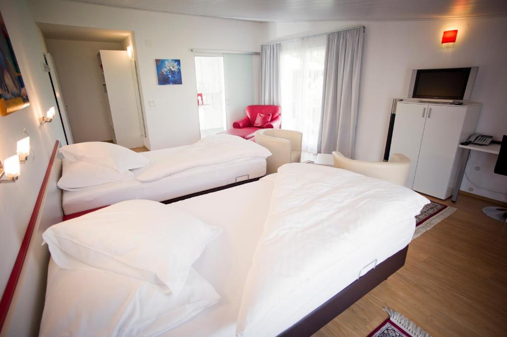 Postel nebo postele na pokoji v ubytování Hotel Hohberg "Next to BBC Arena"