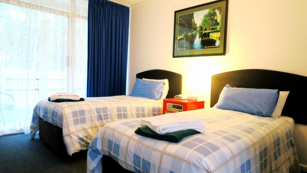 Postel nebo postele na pokoji v ubytování New Norfolk Junction Motel