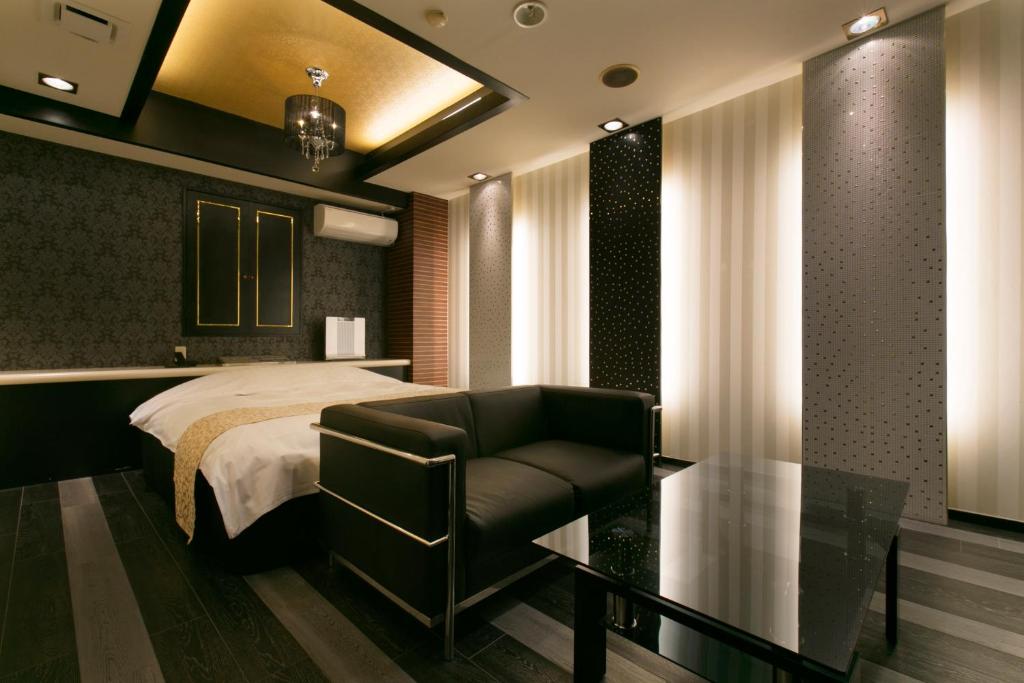 Postel nebo postele na pokoji v ubytování Hotel Atlantis Higashi Osaka (Adult Only)
