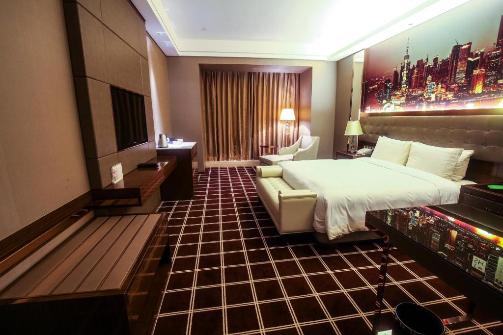 Postel nebo postele na pokoji v ubytování Royal Century Hotel Shanghai