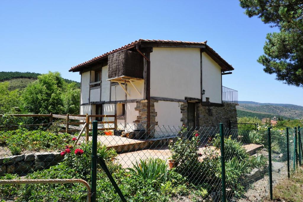 a small house sitting on top of a hill at Casa del Pinar in Enciso