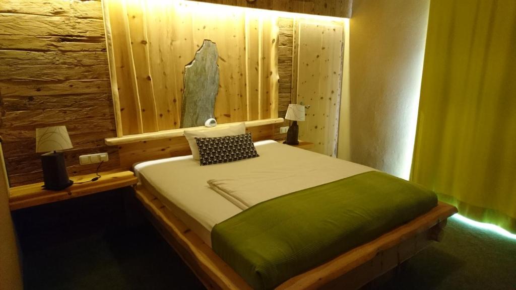 Postel nebo postele na pokoji v ubytování Hotel & Auberge le Journal