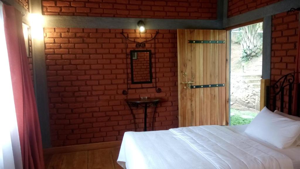 Postel nebo postele na pokoji v ubytování Tea Leaf Retreat