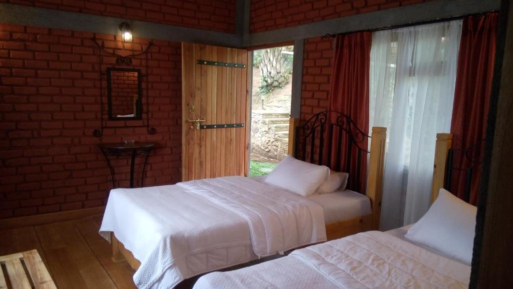 Postel nebo postele na pokoji v ubytování Tea Leaf Retreat