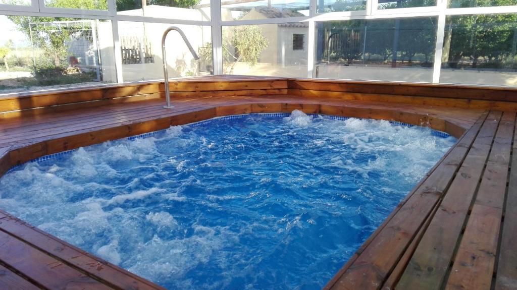 a hot tub in the middle of a house at Casas Rurales Noguericas in Archivel