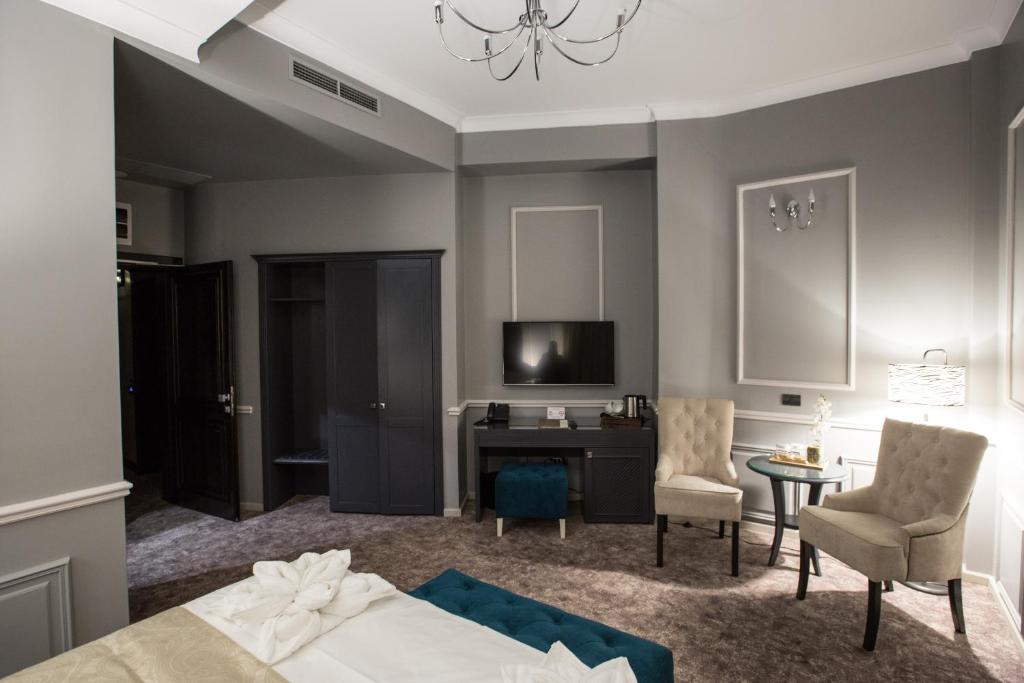 Postel nebo postele na pokoji v ubytování Peninsula Boutique Hotel