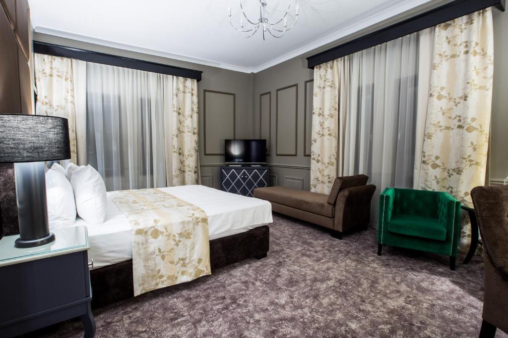 Postel nebo postele na pokoji v ubytování Peninsula Boutique Hotel