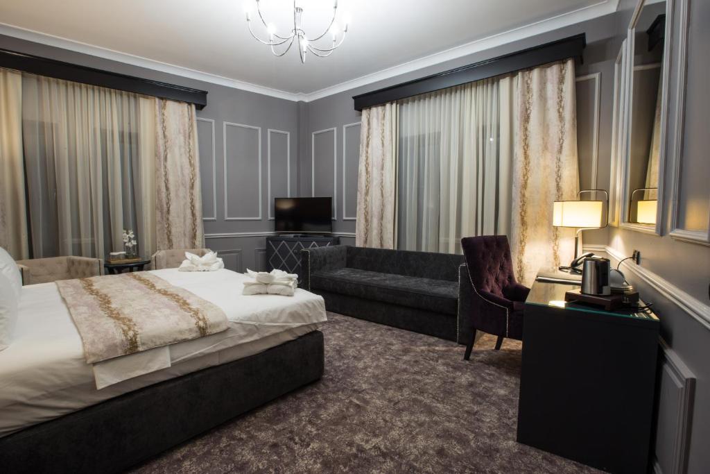 Postel nebo postele na pokoji v ubytování Peninsula Boutique Hotel