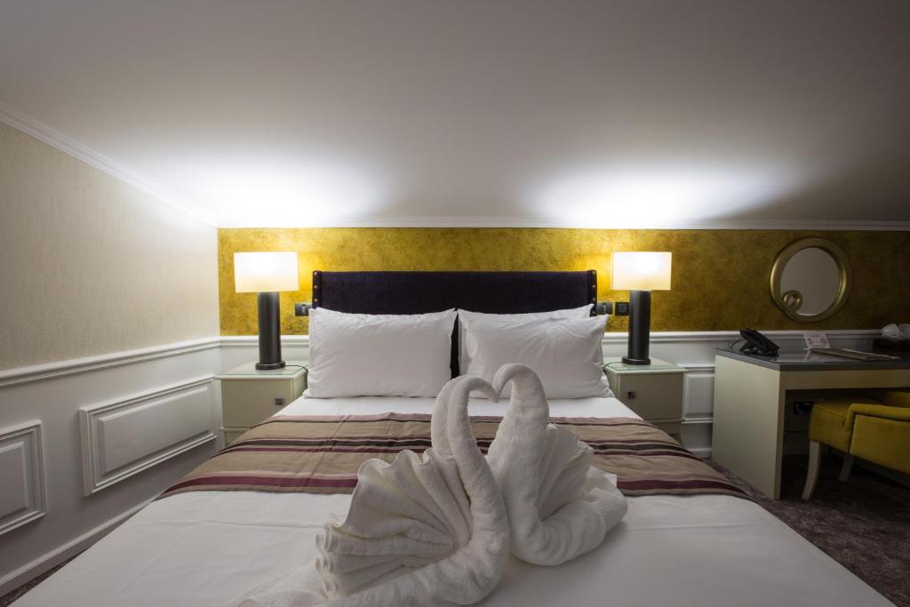 Postel nebo postele na pokoji v ubytování Peninsula Boutique Hotel