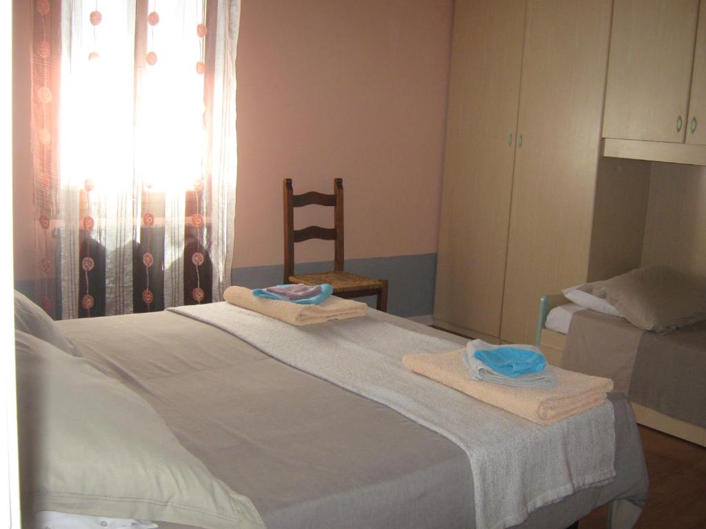 Postel nebo postele na pokoji v ubytování Albergo Sangalli