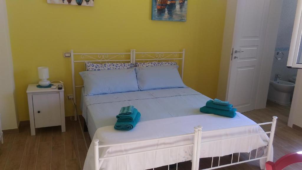 Postel nebo postele na pokoji v ubytování B&B Excelsior