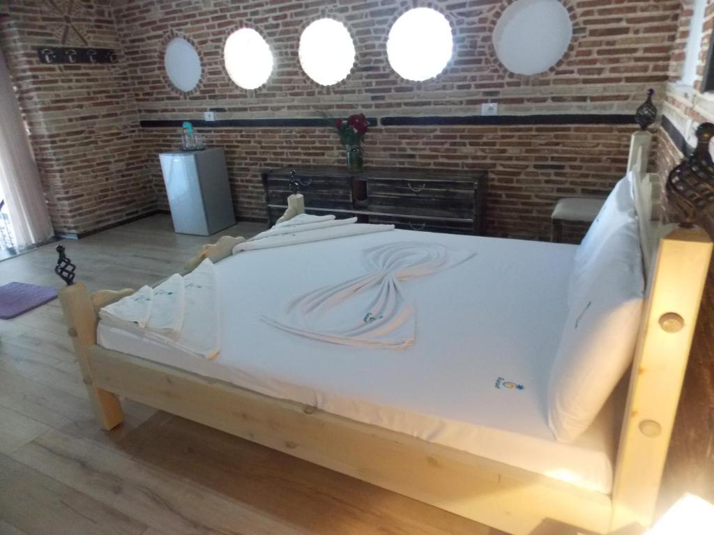 Postel nebo postele na pokoji v ubytování Sunset Suites