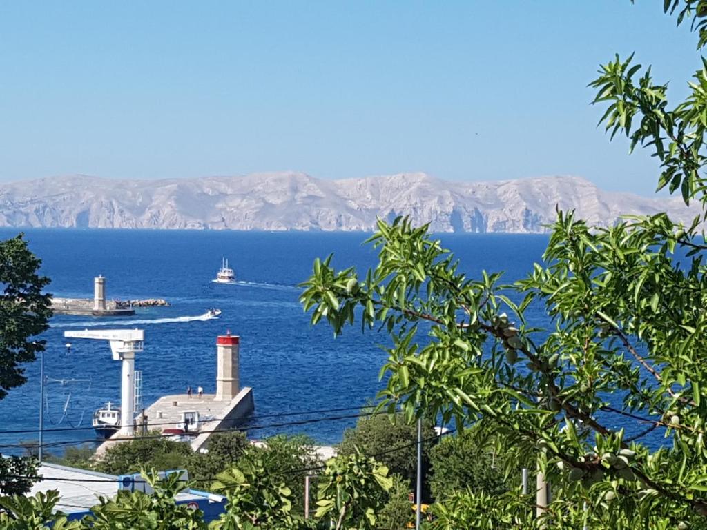 a view of a large body of water with a boat at Guest House Sombrero in Senj