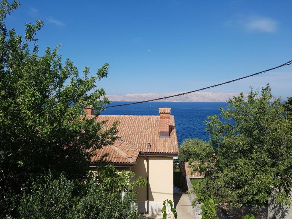 a house with a view of the ocean at Guest House Sombrero in Senj