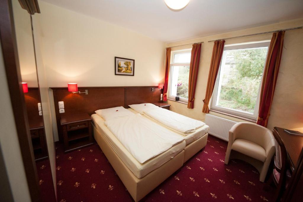 Postel nebo postele na pokoji v ubytování Hotel Medaillon