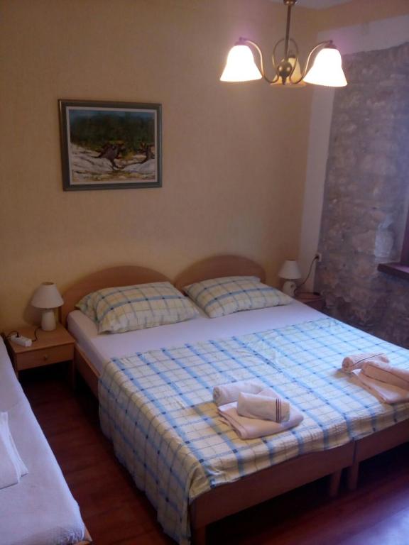 Postel nebo postele na pokoji v ubytování Apartman i Sobe Čule Cres