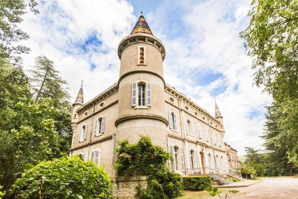 an old castle with a tower on top of it at Chateau de Bournet in Grospierres