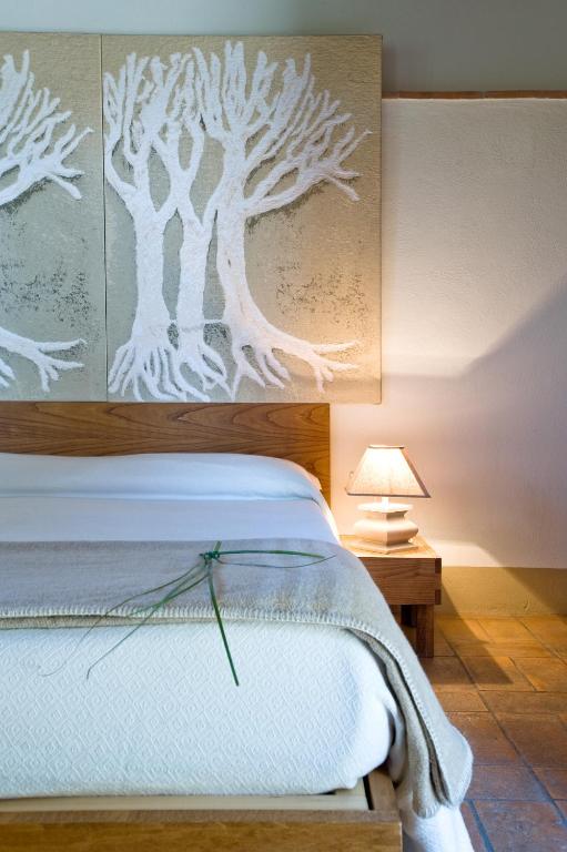 Postel nebo postele na pokoji v ubytování Poderi Arcangelo