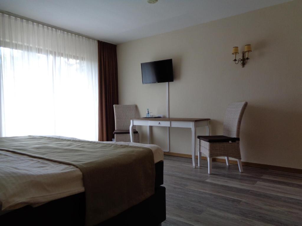 Postel nebo postele na pokoji v ubytování Hotel Garni Eichhornkobel